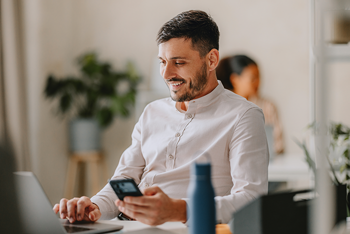 Man at desk on working on laptop
