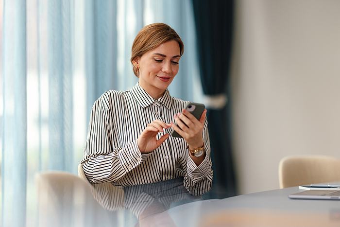 Women in meeting room on the phone